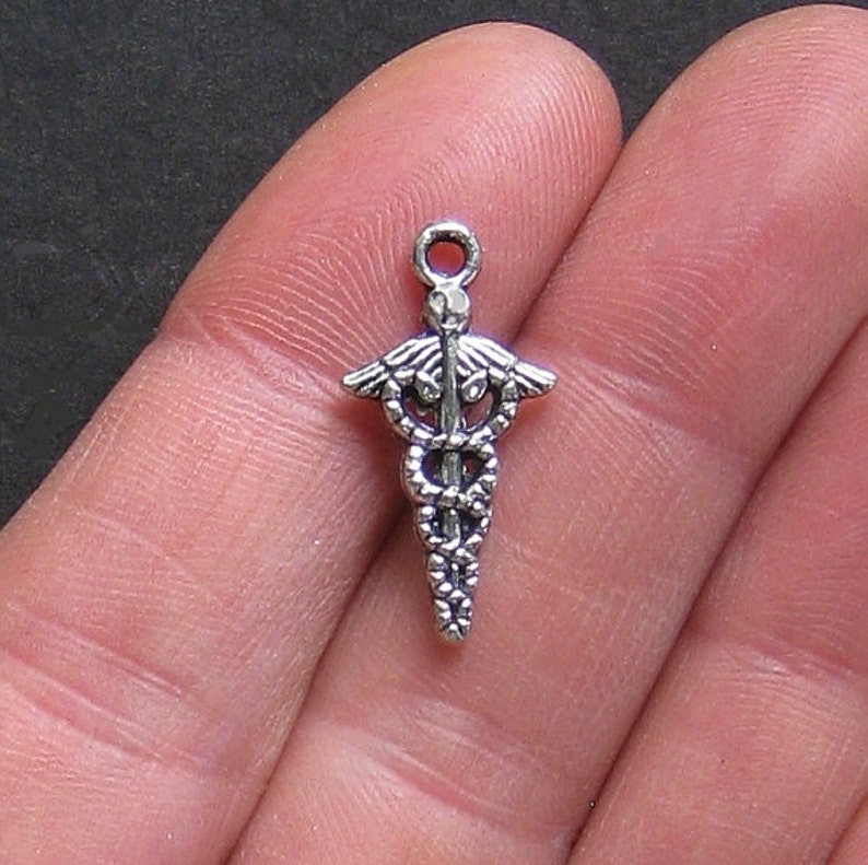 8 Football Helmet Charms Antique Silver Tone SC792