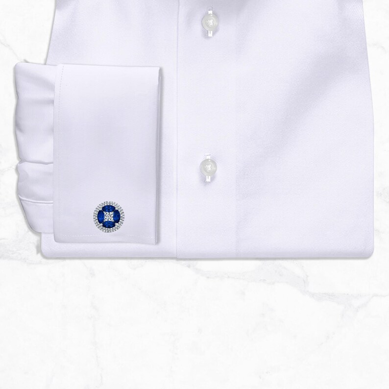 White cutaway collar dress shirt made from 100% Giza cotton poplin with French square cuffs, smooth back, no pocket, collar stays, 3-inch collar wings, and 1.5-inch collar band.