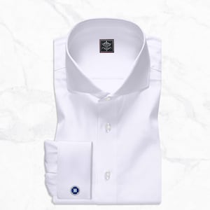 White cutaway collar dress shirt made from 100% Giza cotton poplin with French square cuffs, smooth back, no pocket, collar stays, 3-inch collar wings, and 1.5-inch collar band.