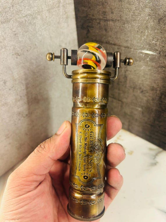 A real artisan-made brass kaleidoscope that doubles as a desk sculpture — analog optical wonder in an age of screens.