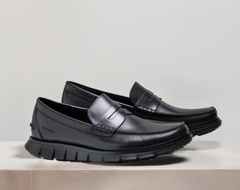 Mocassini Penny in pelle nera da uomo / Slip-On con suola ibrida