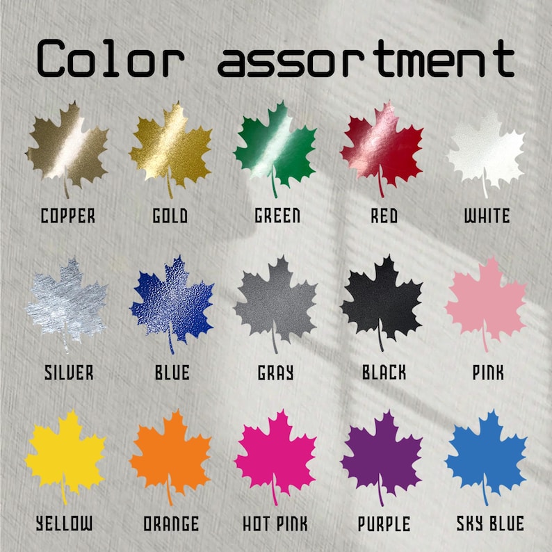 Puede incluir: Una tabla de surtido de colores con formas de hojas de arce en varios colores. Los colores incluyen cobre, oro, verde, rojo, blanco, plata, azul, gris, negro, rosa, amarillo, naranja, rosa intenso, morado y azul cielo. El texto "Color assortment" est&aacute; en la parte superior.