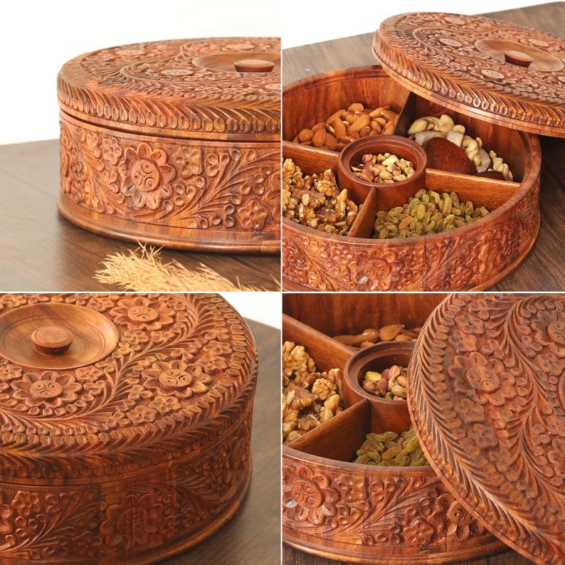May include: A round wooden serving tray with a lid, intricately carved with floral patterns. The tray is divided into compartments, filled with nuts and dried fruits. The lid has a small wooden knob.