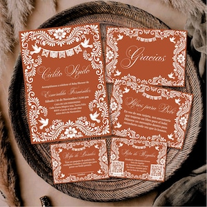 May include: A set of terracotta-colored baby shower invitation cards featuring white floral borders, flying doves, and papel picado bunting designs. The text includes Cielito Lindo, Gracias, Libros para Bebé, Rifa de Pañales, and Lista de Regalos.