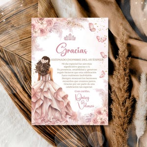 May include: A thank you card with a watercolour illustration of a woman in a pink gown. The card features the word "Gracias" and a message of gratitude. Soft pink floral and butterfly accents surround the text.