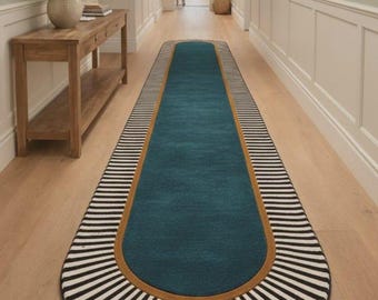 Elegant hallway featuring sage walls, wooden console, floral decor, and a patterned runner rug