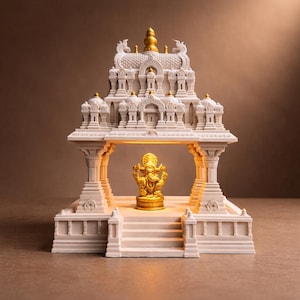 May include: A detailed, white and gold decorative temple structure with a golden statue of a deity inside. The temple features intricate architectural details, including columns, steps, and a domed roof. The statue is illuminated, creating a warm glow.