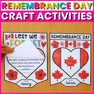 Può includere: Attività di artigianato per il Giorno della Memoria. Due lavoretti di carta con disegni di papaveri e foglie d'acero. Uno ha una carta a forma di cuore con il testo "Lest we forget" e un messaggio. L'altro ha una bandiera canadese a forma di cuore.