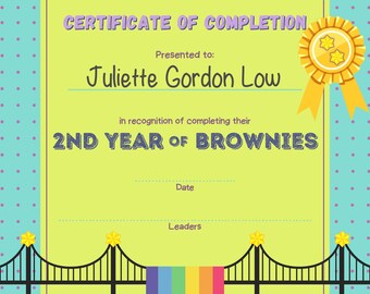 May include: A yellow and green certificate of completion with a blue and white polka dot border. The certificate is for Juliette Gordon Low for completing their 2nd year of Brownies.