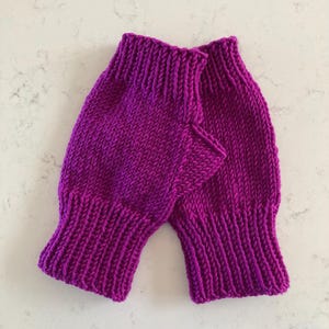 Women’s fingerless mittens/texting gloves, hand-knitted using fine merino yarn, available in a variety of colours.