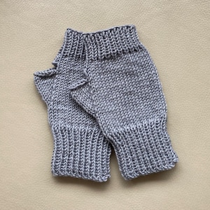 Women’s fingerless mittens/texting gloves, hand-knitted using fine merino yarn, available in a variety of colours.