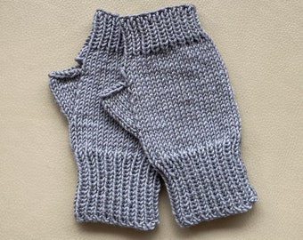 Women’s fingerless mittens, hand-knitted using fine merino yarn, available in a variety of colours.