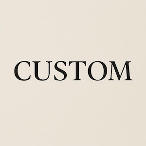 May include: The word "CUSTOM" is displayed in a bold, black font against a cream-colored background. The text is centered and takes up a significant portion of the image.