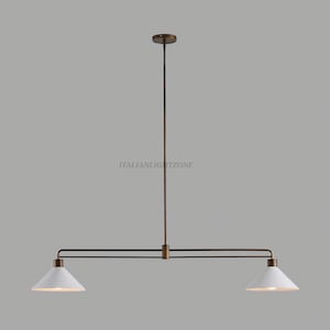 May include: A contemporary pendant light with two lamps. It has a bronze-coloured frame and two white, cone-shaped shades. The text "ITALIANLIGHTZONE" is visible. The light is suspended from a long, vertical rod.