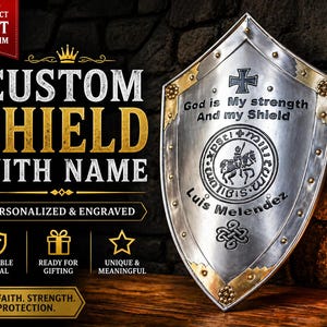 May include: A silver-colored shield with gold accents, featuring the text "CUSTOM SHIELD WITH NAME" and "PERSONALIZED & ENGRAVED." The shield has a cross and a circular emblem with a knight on a horse. The text "God is My strength And my Shield" is also visible.