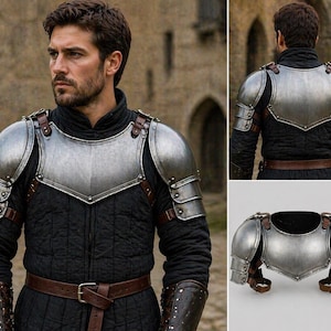 May include: A silver-colored metal chest and shoulder armor set with brown leather straps and a black quilted undergarment. The armor is designed with a medieval aesthetic, featuring a polished finish.