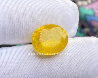 Lab-Created Yellow Sapphire Gemstone: 12.50 Carat Oval Cut