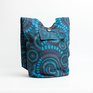 May include: A blue and black patterned tote bag with a single button closure and a front pocket.