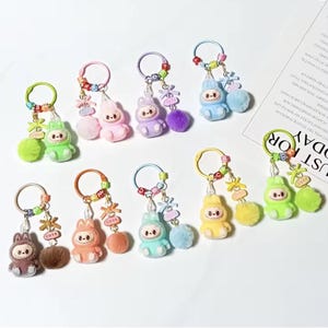 Nuevo mini llavero de dibujos animados Kawaii Labubu, accesorios para mochilas y estuches, regalos (posición sentada)