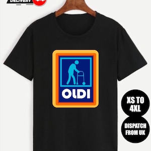 Puede incluir: Camiseta negra con un gráfico de una persona usando un andador dentro de un cuadrado azul con borde naranja, y la palabra "OLDI" en blanco. La camiseta también tiene el texto "XS TO 4XL" y "DISPATCH FROM UK".