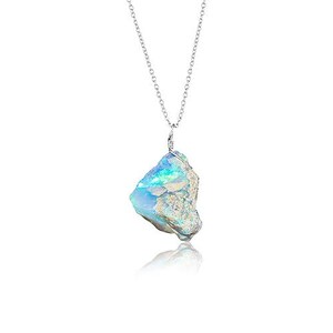 May include: A silver necklace featuring a large, raw opal pendant. The opal displays a mix of blue, green, and white colors. The pendant is irregularly shaped and suspended from a delicate silver chain. The background is white.