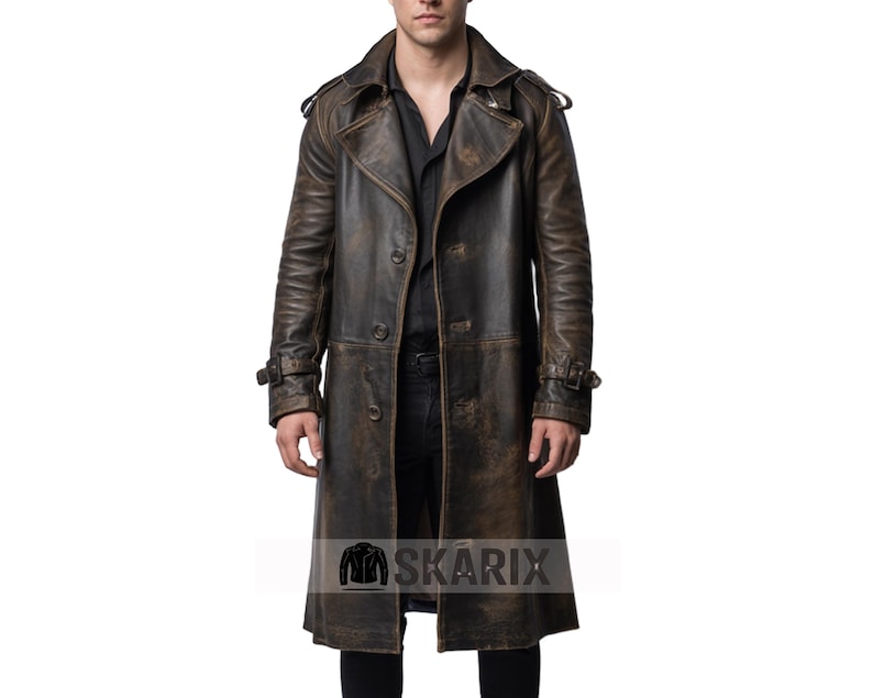 May include: A distressed brown leather trench coat with a double-breasted design. The coat features a notched collar, shoulder epaulettes, and adjustable cuffs. The coat has a vintage, worn appearance.
