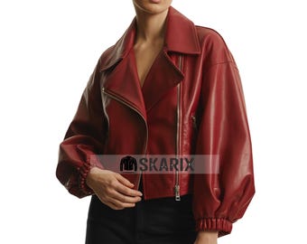 May include: A red leather jacket with a wide collar and a zipper closure. The jacket has long, puffy sleeves and a fitted waist. The brand name SKARIX is visible on the lower right side of the jacket.