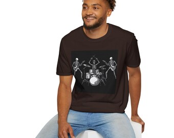 May include: A dark brown t-shirt with a black square graphic depicting a skeleton band playing instruments. The band includes a drummer and two guitarists. The t-shirt is made of a soft material.