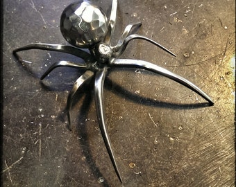 Steel Widow ~ in the black widow family. Each is handmade and unique. Hand faceted orb. 3 inches long Made to Order