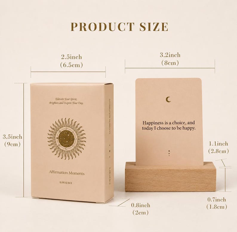 May include: A set of affirmation cards with a wooden stand. The box is 3.5 inches (9cm) tall and 2.5 inches (6.5cm) wide, with the words "Affirmation Moments" on the front. The card is 3.2 inches (8cm) wide and 1.1 inches (2.8cm) tall, with the text "Happiness is a choice, and today I choose to be happy."