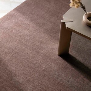 Hand tufted solid brown wool rug in modern living room, minimalist neutral carpet with soft texture and luxury finish for home decor