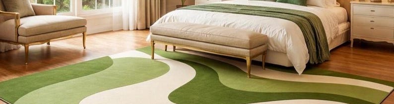 May include: A bedroom scene featuring a green and white patterned rug. The rug's design has a flowing, organic shape. A bed with white linens and a green throw is in the background, along with a bench and a chair.