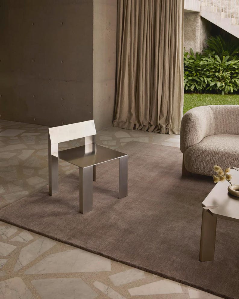 Hand tufted solid brown wool rug in modern living room, minimalist neutral carpet with soft texture and luxury finish for home decor