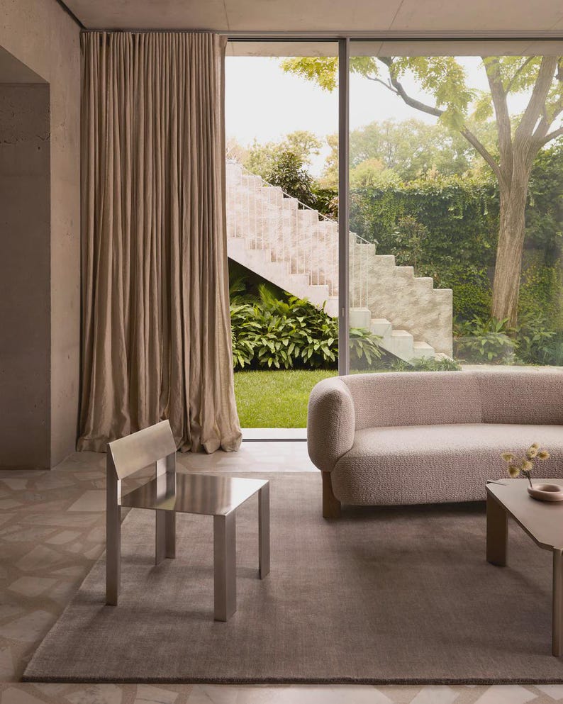 Hand tufted solid brown wool rug in modern living room, minimalist neutral carpet with soft texture and luxury finish for home decor
