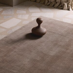 Hand tufted solid brown wool rug in modern living room, minimalist neutral carpet with soft texture and luxury finish for home decor