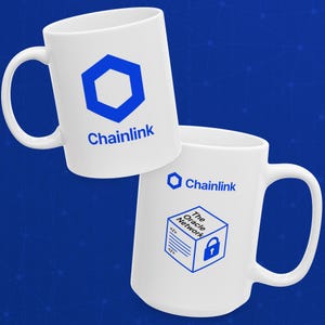 May include: Two white ceramic mugs with blue Chainlink logos. One mug features a blue hexagon logo and the word "Chainlink." The other mug has a blue logo with the text "The Oracle Network" and a padlock icon.