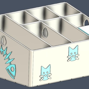 May include: A light-colored multi-compartment organizer featuring a fish skeleton cutout on the side, cat face icons on the front, and the name Bella printed in blue. One compartment has a lid labeled Treats. The structure has a slanted top edge.