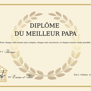 May include: A beige certificate with gold trim and text in French. The certificate reads "DIPL&Ocirc;ME DU MEILLEUR PAPA" with a laurel wreath design. It is awarded to Thomas, signed by Emma et Theo, and dated June 6, 2025, in Orl&eacute;ans.