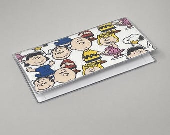 Portada de chequera con personajes de Peanuts