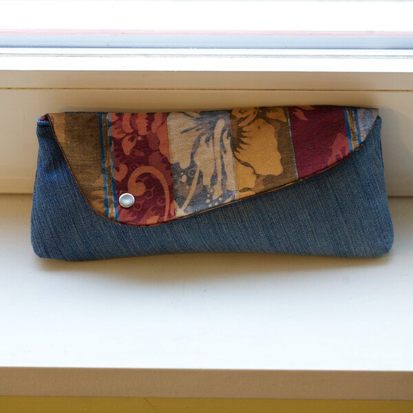 Balinese batik and handwoven songket textile and recycled denim clutch with snap closure