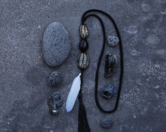 knitted necklace MAZOR, black, pebbles, feather, tassel