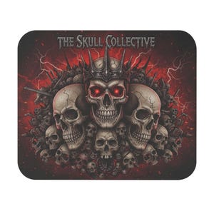 May include: A rectangular mousepad with a detailed illustration of skulls. The central skull wears a crown and has glowing red eyes. The words "THE SKULL COLLECTIVE" are printed at the top against a red background with lightning.