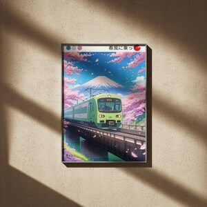 Könnte beinhalten: Gerahmter Kunstdruck mit einem grünen Zug, der eine Brücke überquert, mit dem Fuji im Hintergrund. Die Szene zeigt Kirschblüten mit rosa Blüten und blauem Himmel. Japanischer Text befindet sich oben.