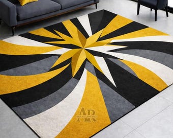 Tappeto moderno geometrico in lana trapuntato a mano, nero e oro, con motivo astratto a stella.