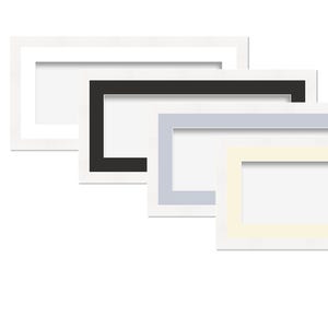 May include: Four rectangular picture frames in white, black, light blue, and cream colours. Each frame has a white border and a rectangular opening in the centre. The frames are stacked diagonally, showcasing the different colour options.