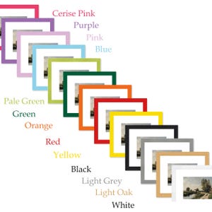 May include: A selection of framed art prints in a range of colours: cerise pink, purple, pink, blue, pale green, green, orange, red, yellow, black, light grey, light oak, and white. Each frame contains a landscape painting.