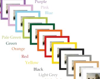 May include: A collection of framed art prints in various colors, including cerise pink, purple, pink, blue, pale green, green, orange, red, yellow, black, light grey, light oak, and white. Each frame surrounds a landscape painting.