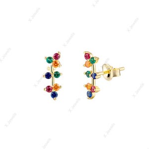 May include: A pair of gold stud earrings featuring a curved bar design adorned with small, round, multi-colored gemstones in shades of red, green, orange, and blue. The earrings include a standard post and butterfly back closure mechanism.