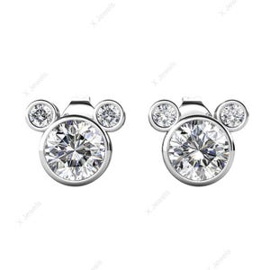 May include: A pair of silver-toned stud earrings. Each earring features a large, round, clear gemstone at the center, with two smaller gemstones above, forming a Mickey Mouse head shape. The gemstones sparkle brightly.