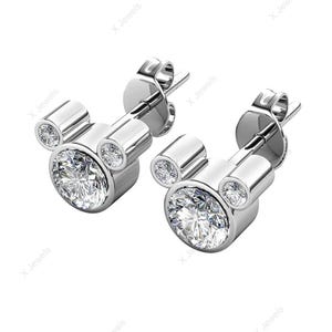 May include: A pair of silver-toned stud earrings. Each earring features a large, round, clear gemstone at the center, with two smaller gemstones above, forming a Mickey Mouse head shape. The gemstones sparkle brightly.